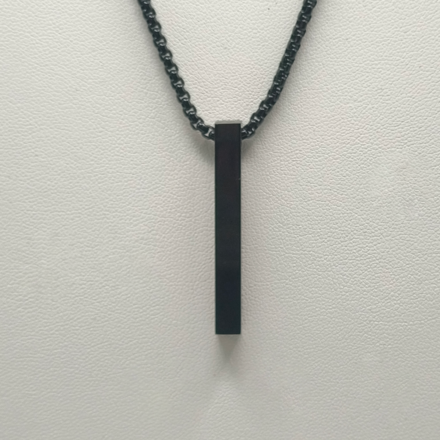 Colgante lingote fino negro código reproductor